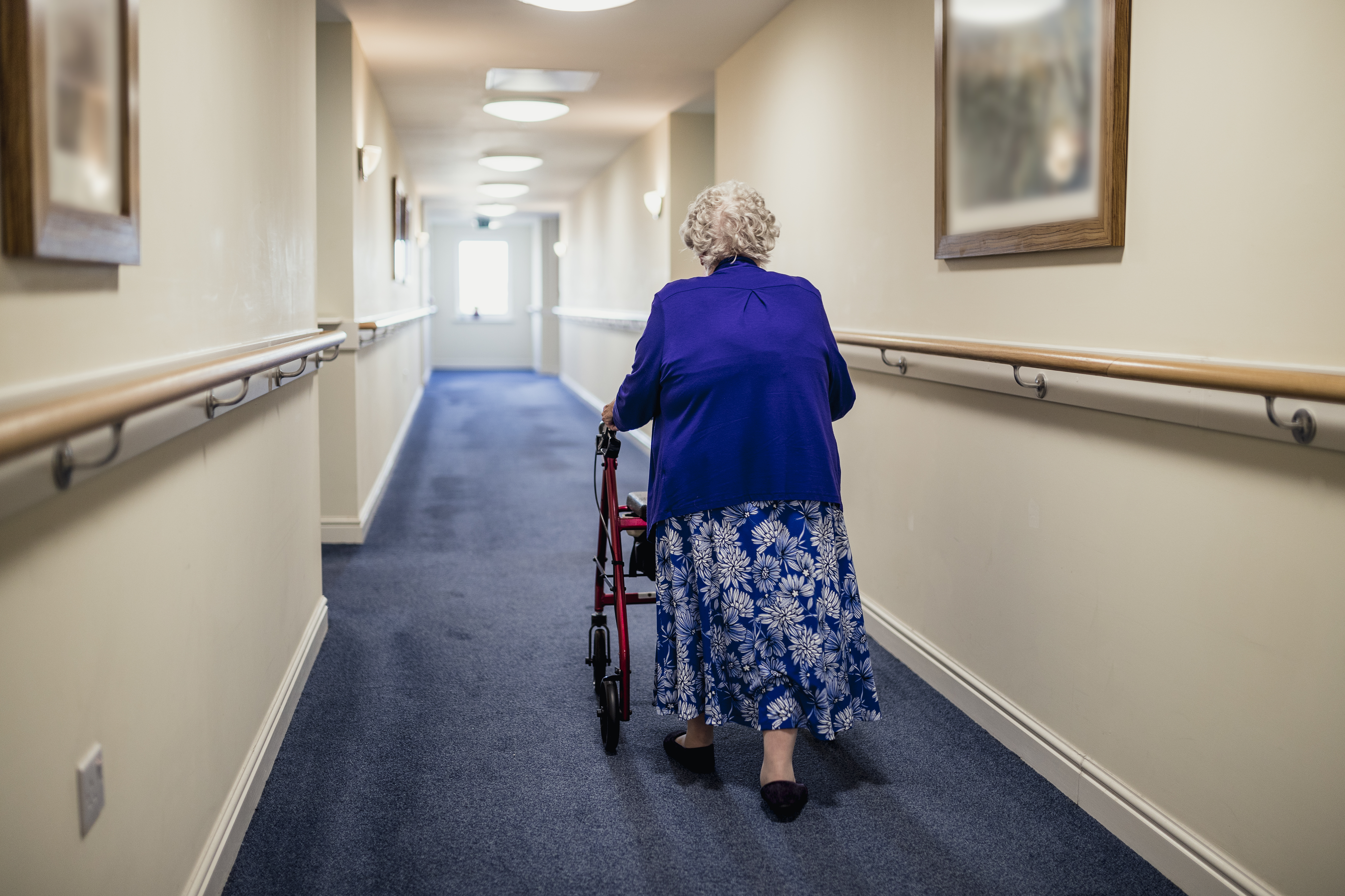 PIC - Woman in care home corridor