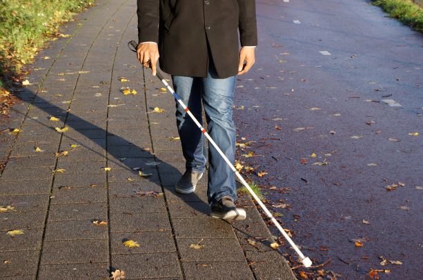 PIC  - Person walking with white cane