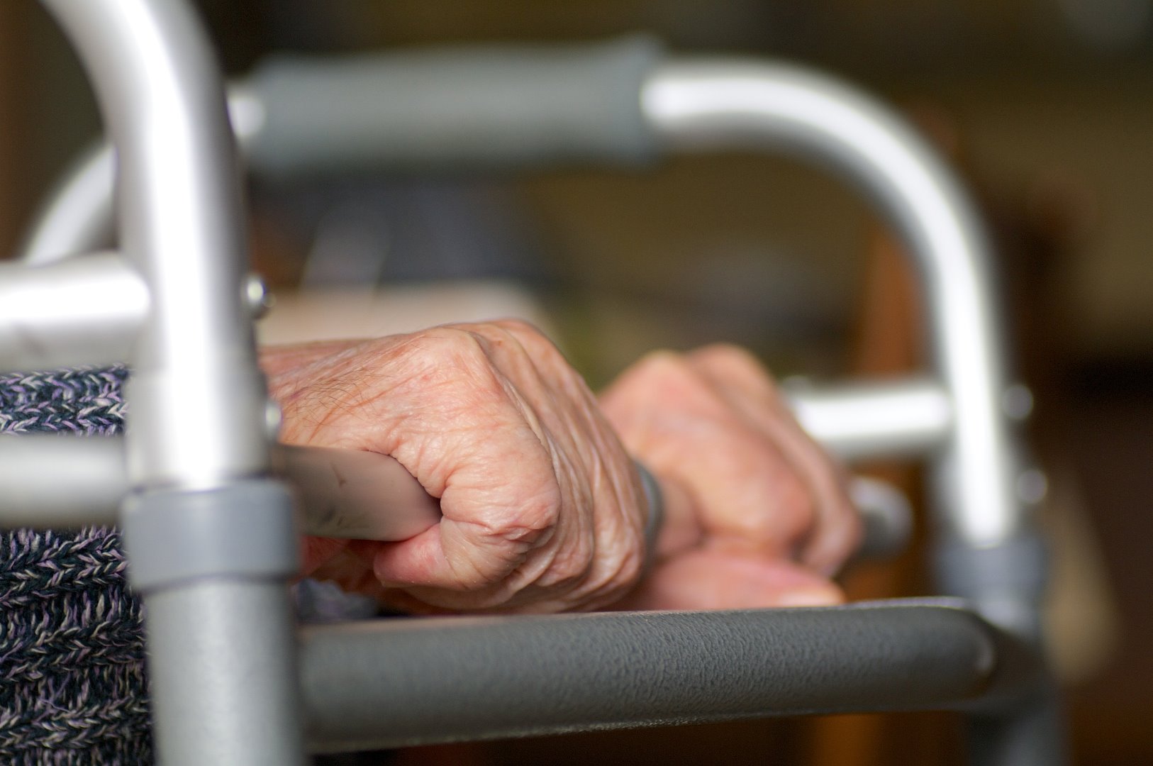 PIC - close up of older hands gripping a zimmer frame
