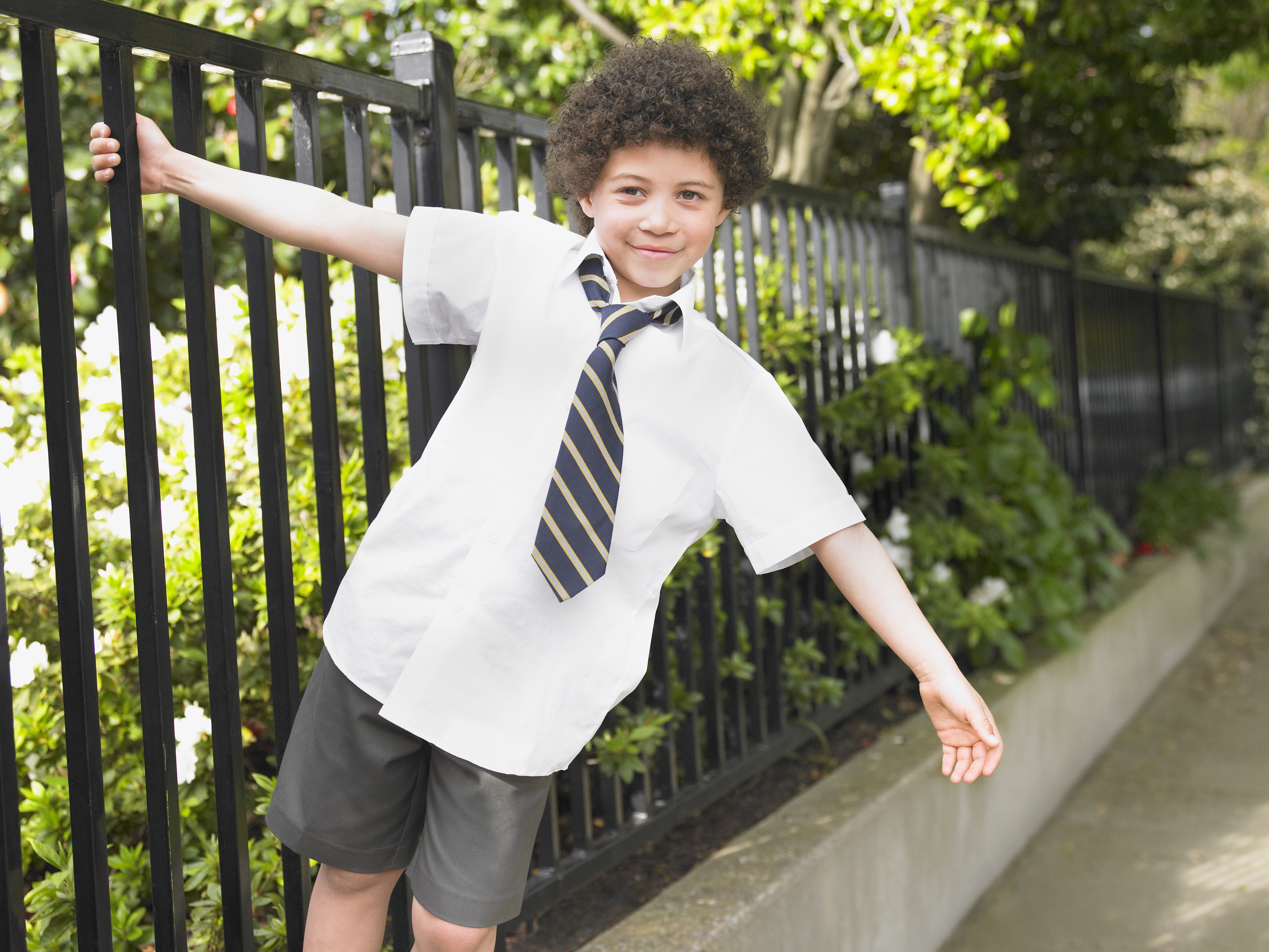 PIC - Boy in uniform at school gates