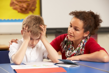 Pic - Boy struggling with schoolwork