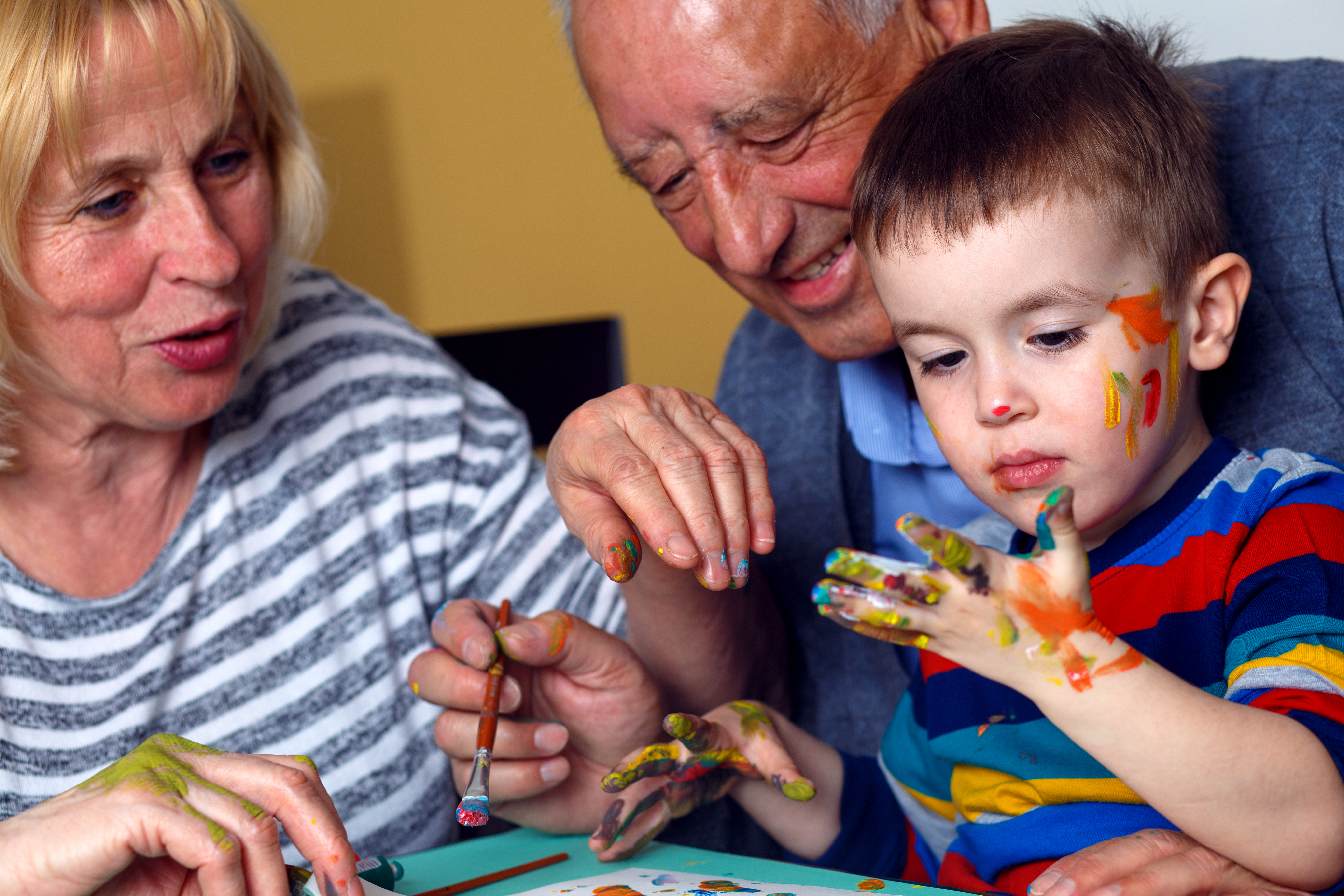 PIC - Older people painting with younger child