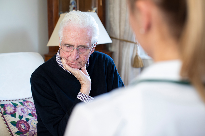 PIC - Sad older man with nurse