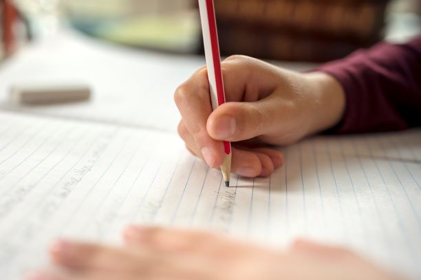 PIC - Child writing with pencil