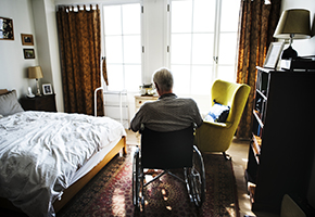 PIC - Older person in wheelchair in bedroom