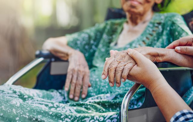 PIC - older lady in wheelchair close up of hands